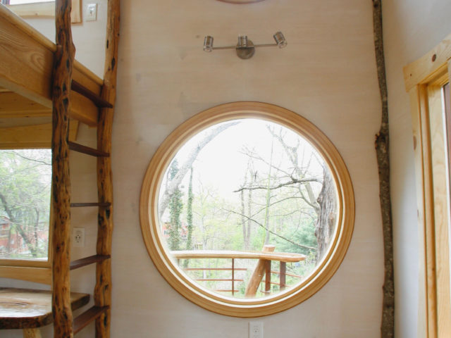 WNC tree house builders: Circular interior windows