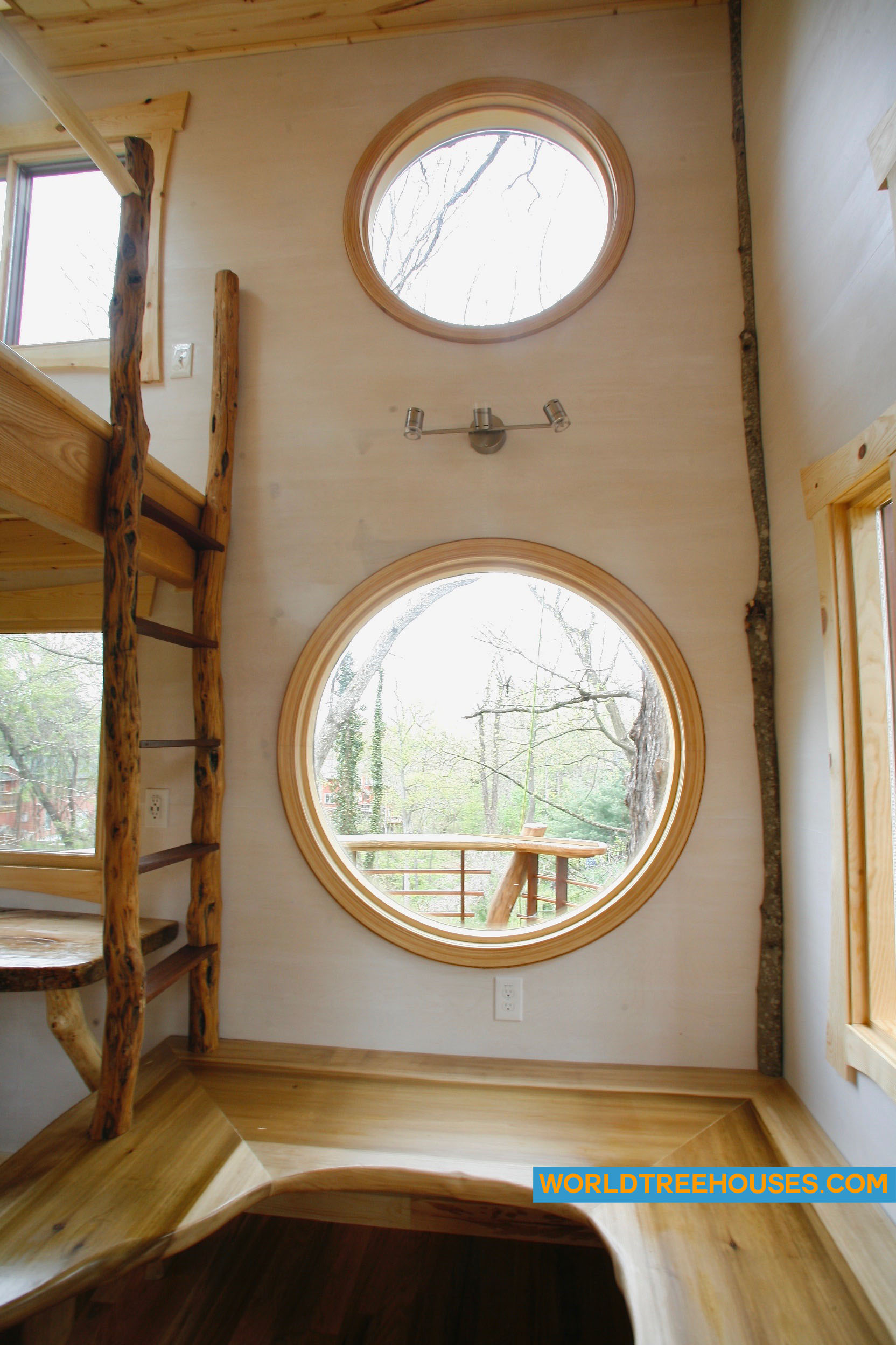 WNC tree house builders: Circular interior windows