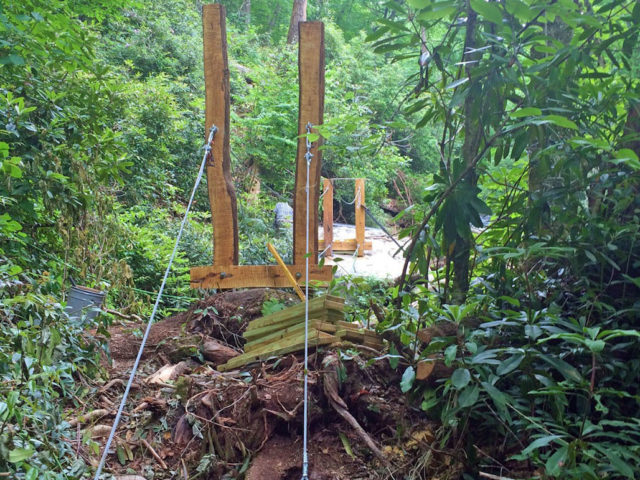 WNC TREE HOUSE BUILDERS : Panthertown swimming hole access: Adding the guy wires that support the bridge