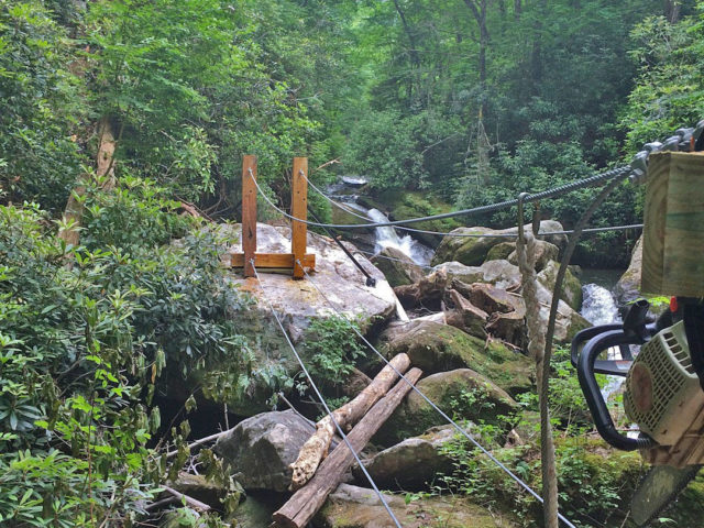 NC tree house builders : Panthertown swimming hole access: The bridge exit posts are up!